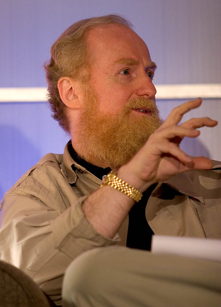 A person with a beard and a gold watch

AI-generated content may be incorrect.